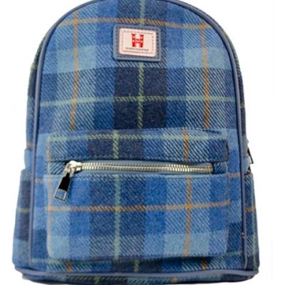 The Skye Blue Check Backpack is an ideal blend of style and functionality, featuring a spacious large main compartment and a convenient front zippered pocket. Its eye-catching design showcases intersecting shades of blue with subtle hints of orange, all beautifully accented by a chic green plaid pattern. Completing its attractive appeal is a distinctive red and white logo patch on top. Perfect for those seeking both practicality and trendsetting fashion in one backpack.