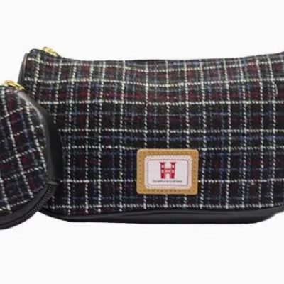 Discover our stylish plaid-patterned clutch bag featuring a matching round coin pouch. This chic clutch showcases a textured fabric in classic black, white, and red tones, accented by a beige patch with an eye-catching logo on the front. The attached coin pouch is designed with a convenient zipper, making it perfect for securing your essentials on the go. Upgrade your accessory collection with this must-have plaid clutch and zippered coin pouch combination!.