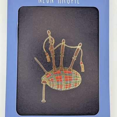 Discover the Neon Magpie set of six cards and envelopes, featuring vibrant bagpipe illustrations. Perfect for sending unique greetings or as a collectors item, these colorful bagpipe cards are beautifully packaged in a blue box with a display window that showcases the stunning design. Ideal for music lovers and those who appreciate artistic stationery, this card set makes for an excellent gift choice.