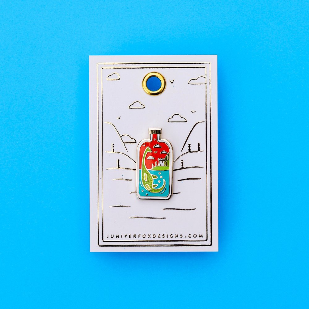 Nessie in a bottle enamel pin
