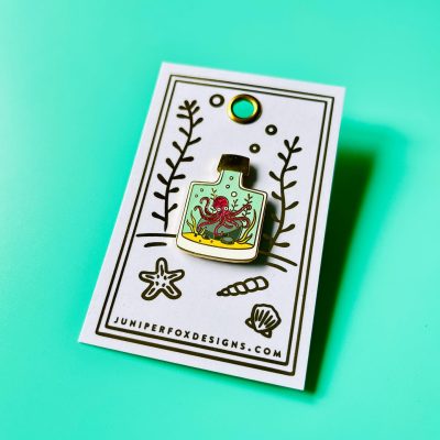 Octopus in a bottle enamel pin